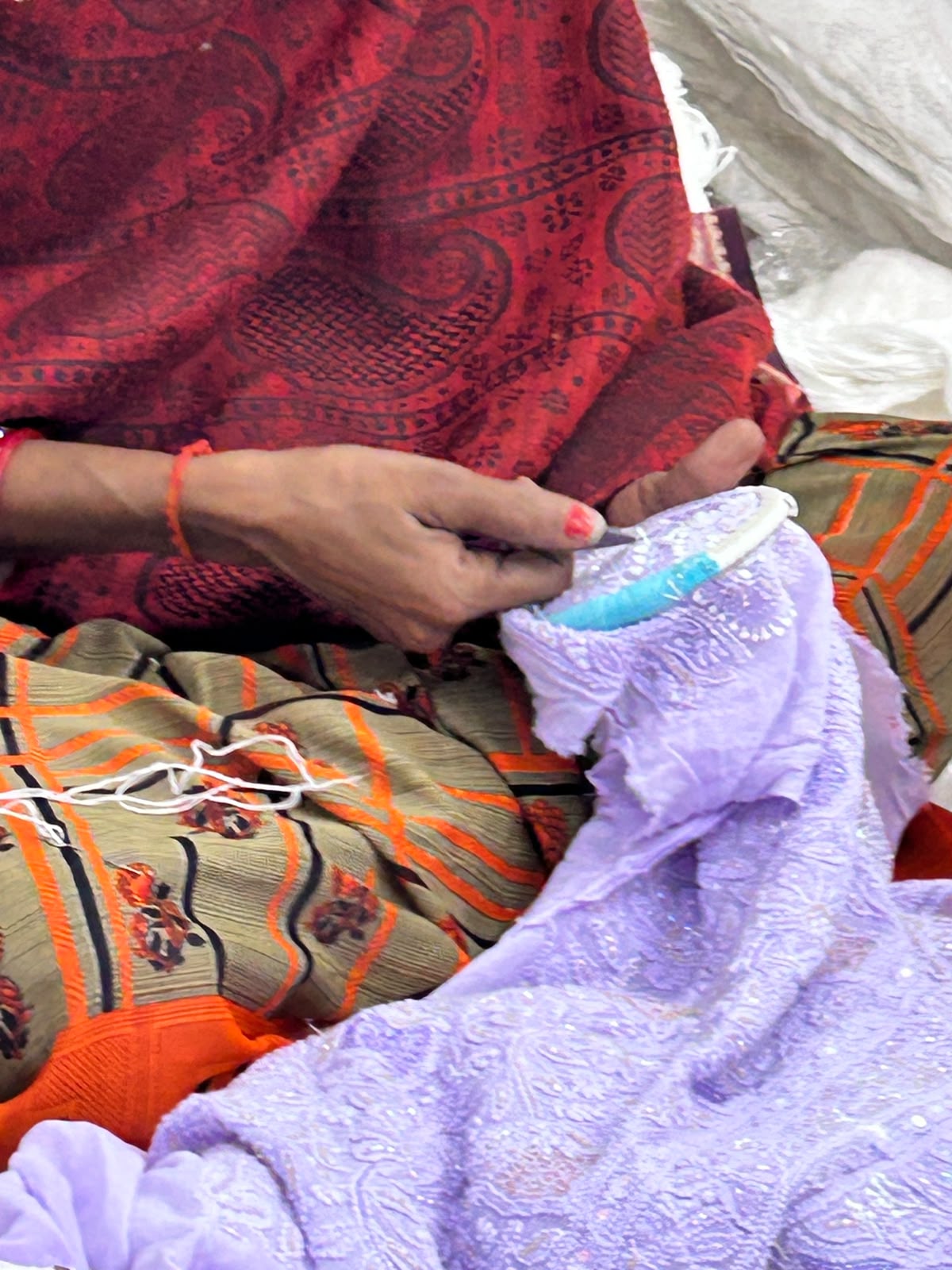 Artisan hand embroidering chikankari